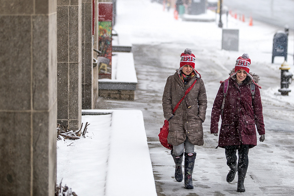 Ruthie Ferrante and Cassidy Smith walking in snowfall