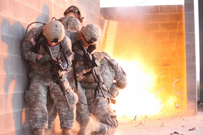 Officers of 1st Stryker Brigade Combat Team, Ready First 1st Armored Division, participate in an urban combat exercise at a training facility on Fort Bliss, Texas.