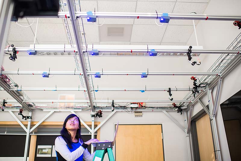 PhD candidate Emily Lam works with smart lighting sensors as part of Thomas Little's research with the Lighting Enabled Systems & Applications Engineering Research Center (LESA ERC) 