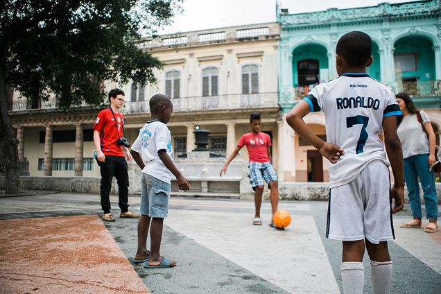 Andreas Xenopoulos with local children on the Paseo de Prado.