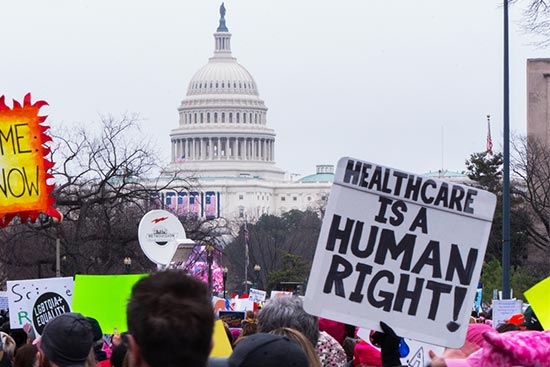 Participants in the Women's March on Washington DC rally outside the White House
