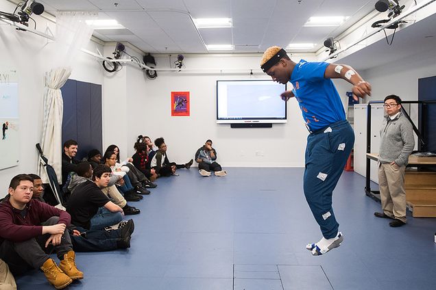 Malaky Lewis jumping in front of classmates