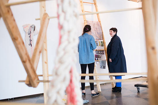 Halvorson working with Marisa Gilbert as Gilbert installs her work for this year’s MFA Thesis Exhibition