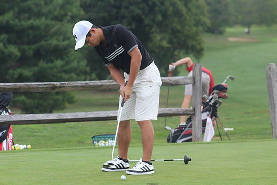 Peter Gunawan practices his putting prior to the East Coast NCCGA Match Play Tournament.