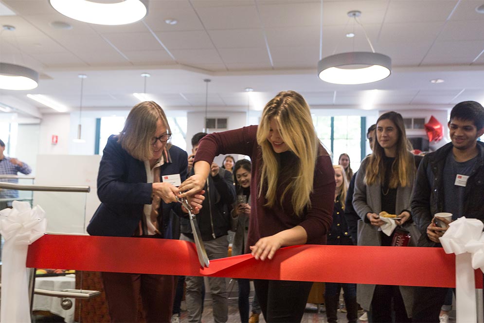 College of Arts and Sciences Dean Ann Cudd and student Christina Lucas cut the ribbon opening the new Think Tank study lounge