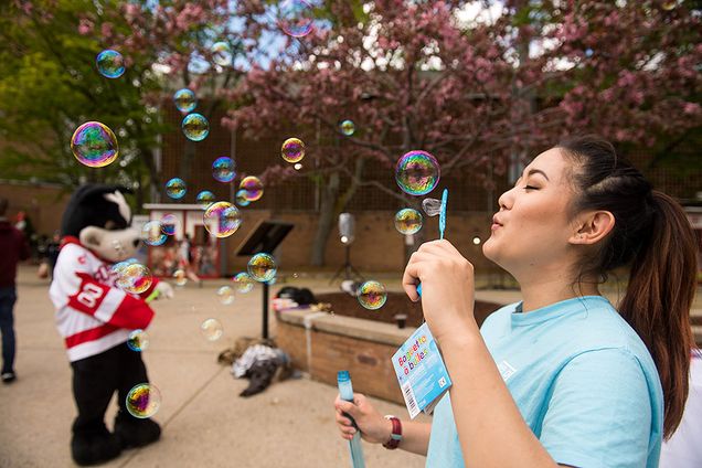 Audrey Sun blowing bubbles