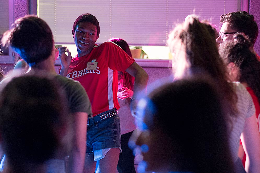 Incoming students and student advisors dance at the Terrier Night Out summer orientation event