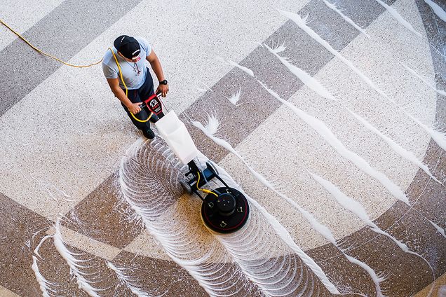 Rene Perez cleaning floor with machine