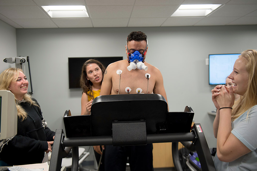 Mark Wadid on treadmill and hooked up to physiology lab equipment