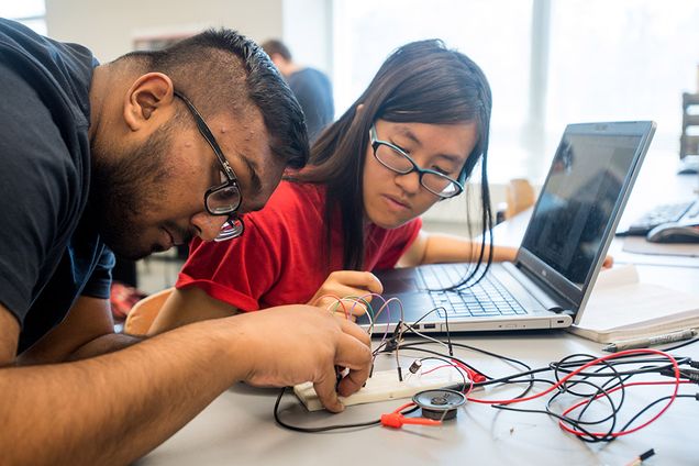 Tariq Ahsan and Ashley Leung work on circuits lab project
