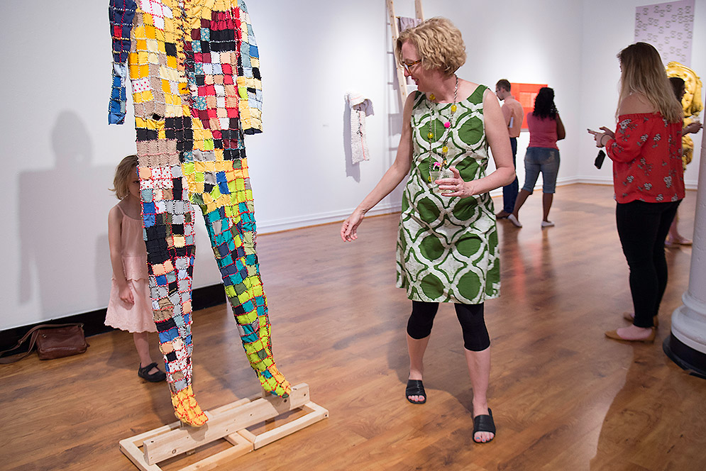 Andrea Saltzman reaching for daughter Ivy