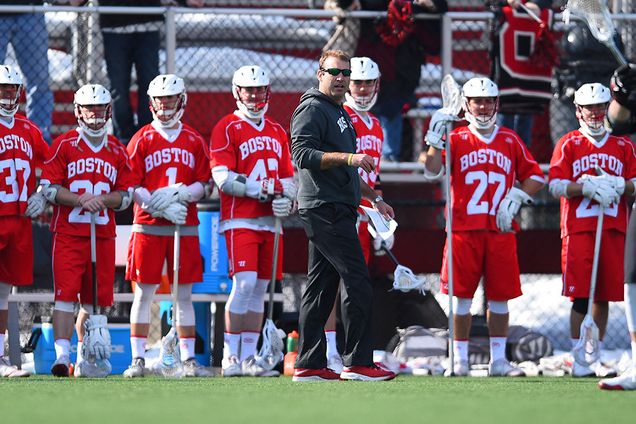 Coach Ryan Polley with team on field