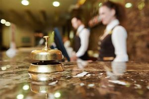 Customer service representatives at the front desk of a hotel