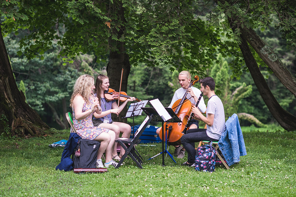 String quartet rehearsing outside