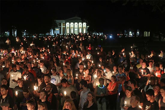 Hundreds gathered on the University of Virginia campus for a candlelight vigil against hate and violence days after Charlottesville erupted in chaos during the "Unite the Right" white nationalist rally.