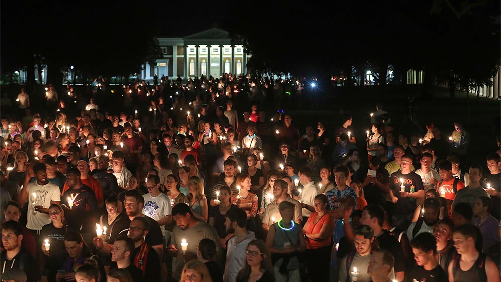 Hundreds gathered on the University of Virginia campus for a candlelight vigil against hate and violence days after Charlottesville erupted in chaos during the "Unite the Right" white nationalist rally.