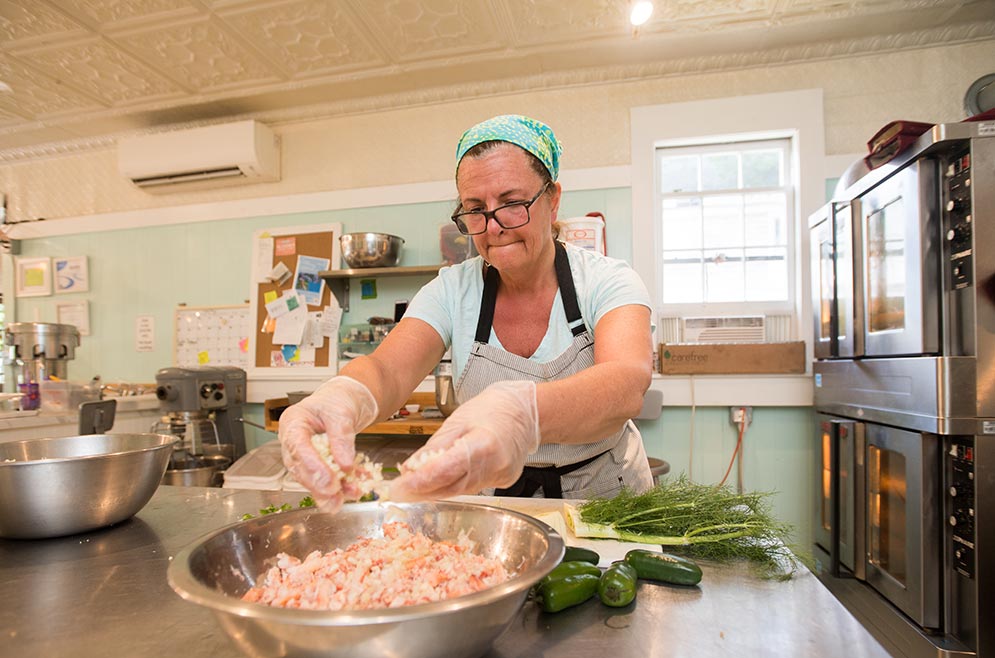 Laura Raposa prepares food at The Foodsmith bakery and cafe in Duxbury, MA