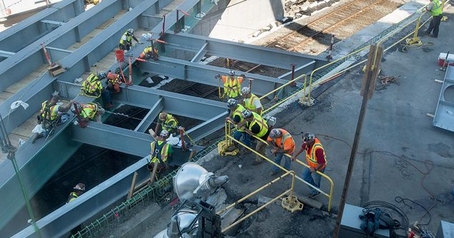 Construction workers and steel girders