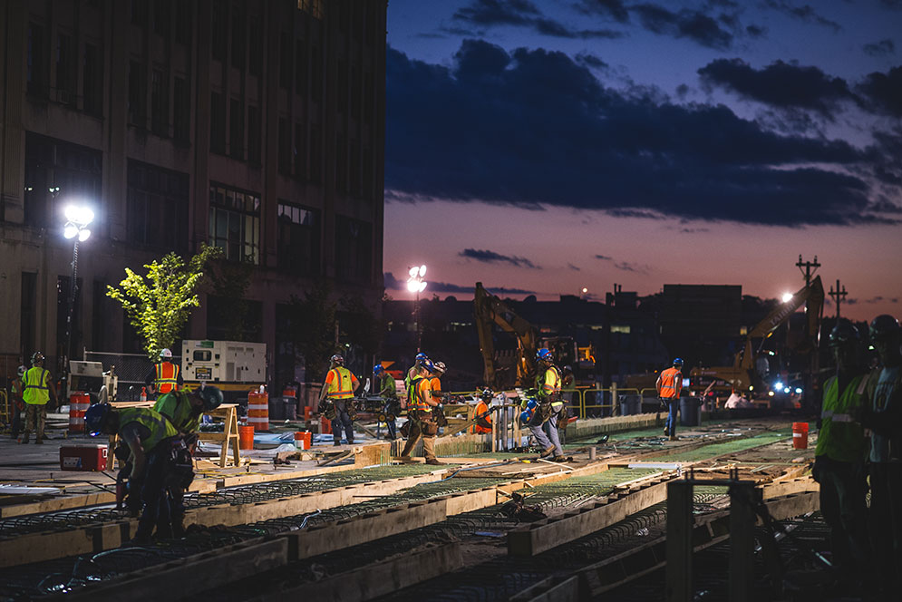 Cotton candy blue and mauve sky serves as a beautiful backdrop for the construction in full-swing on Comm Ave