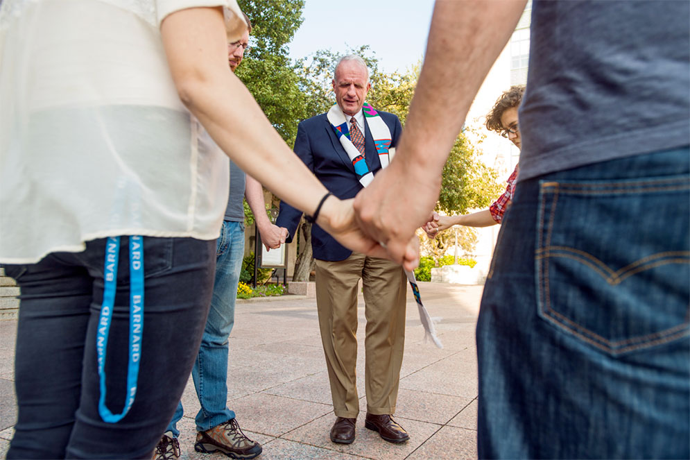 At a prayer vigil on Marsh Plaza, Robert Allen Hill, dean of Marsh Chapel, led a moment of silent meditation for those affected by the Trump order ending President Obama’s Deferred Action for Childhood Arrivals program