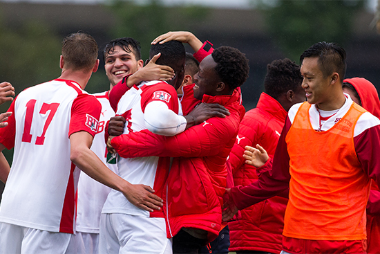 Group shot of BU Men's team at Boston University Men's Soccer versus the Haitian National team at Nickerson Field