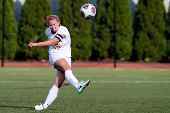 BU Terriers women's soccer player Rachel Bloznalis kicks the ball durring a game