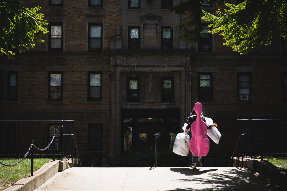 Student carrying instrument during Boston University Fall Move In 2017