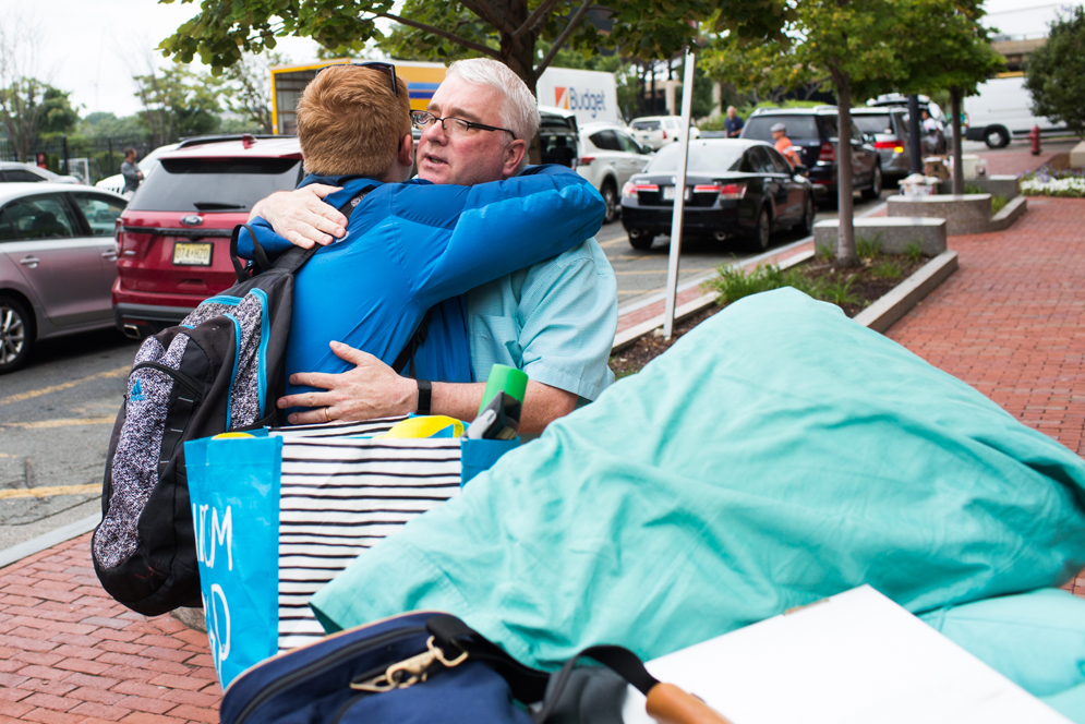 Father and student hug each other during Fall Move In 2017