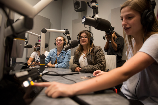 Made Berman (CAS’19) (from left), Camila Beiner (COM’20), Georgia Kotsinis (COM’19), and Hannah Thomas (COM’19) during the inaugural broadcast from WTBU’s new studios on October 4.