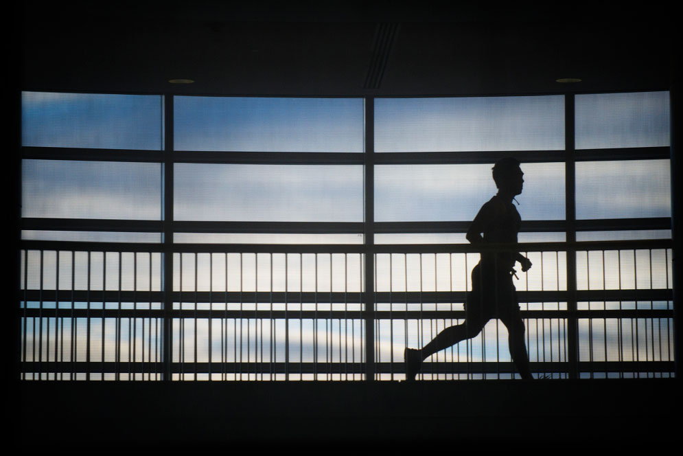 A runner makes his along the indoor track at FitRec Photo By Jackie Ricciardi