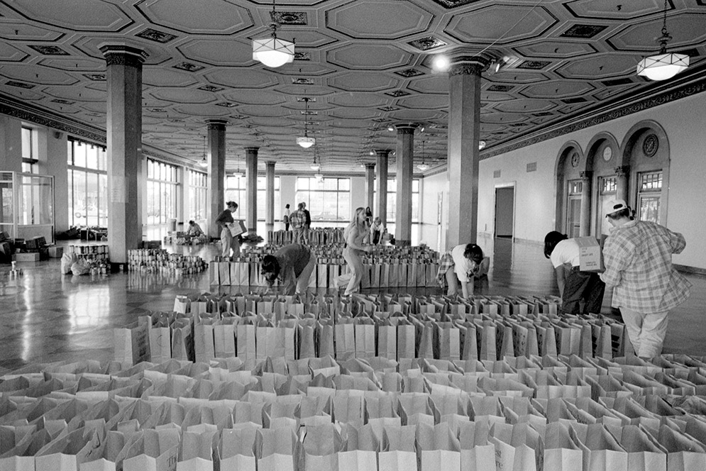 Boston University students volunteer to sort and pack food during a Thanksgiving food basket-building day in 808 Commonwealth Ave on November 23, 1996.   Photo by Kalman Zabarsky for Boston University Photography