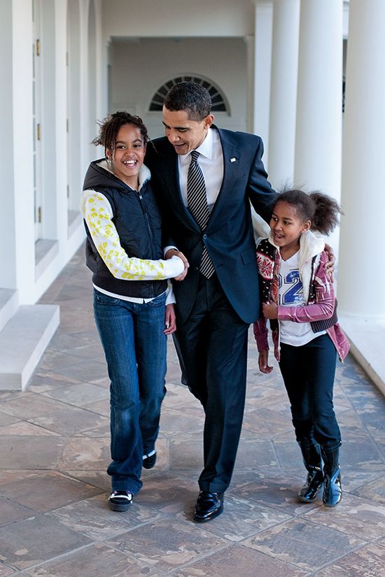 Photograph taken by official White House photographer Pete Souza of President Barack Obama with daughers Malia and Sasha outside the Oval Office