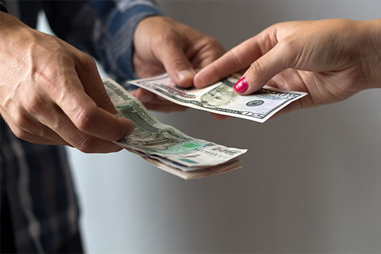 a man and woman exchange money