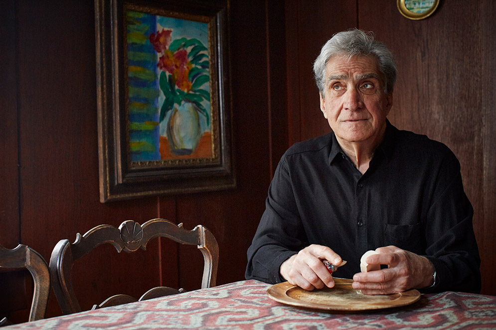 Former US poet laureate Robert Pinsky snacks on cheese