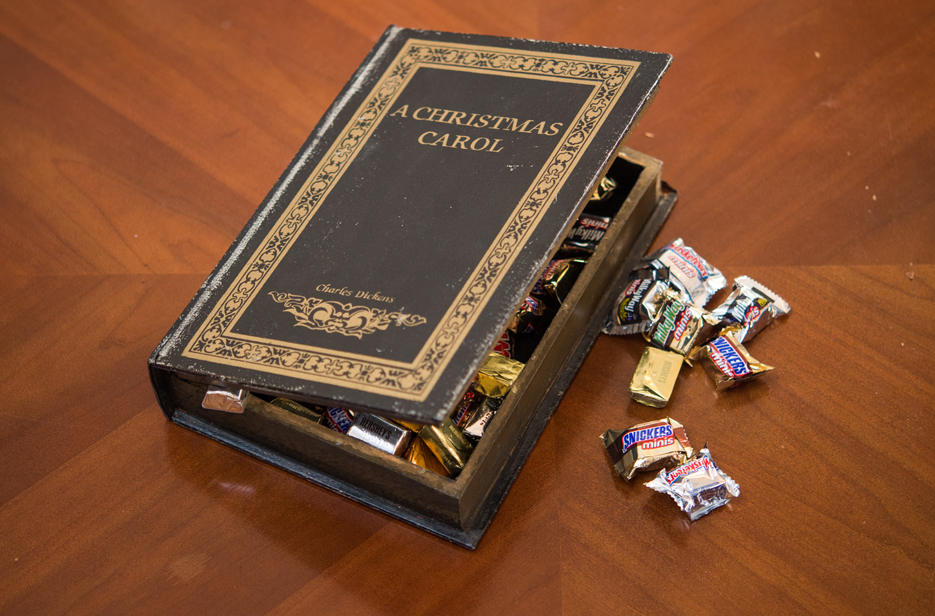 A faux book of A Christmas Carol used to store candy.