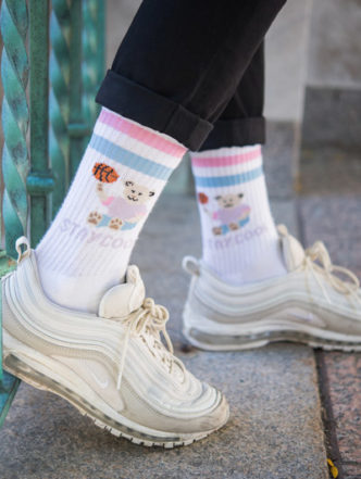 A female modeling StayCoolNYC socks