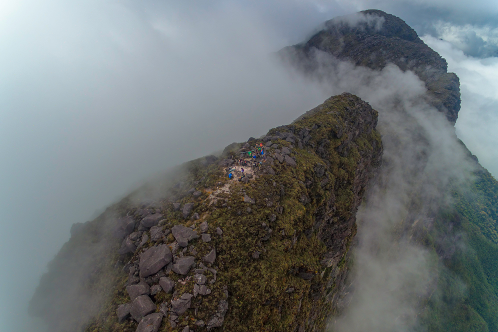 A drone shot of BU experts and Yanomami hosts at the summit of Pico de Neblina.