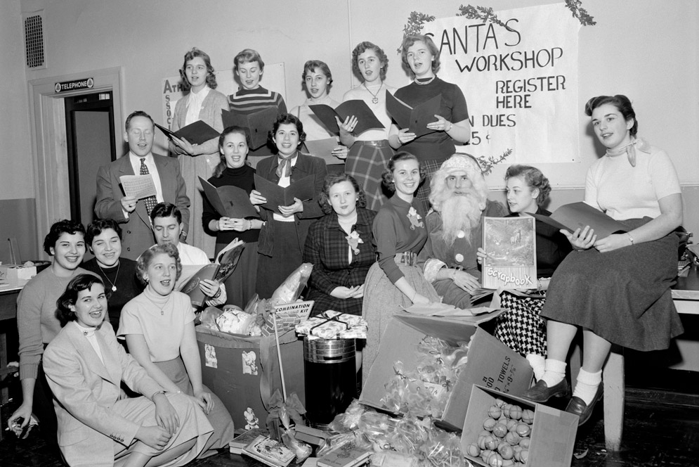 Students sing and wrap presents as part of Santa's workshop. 