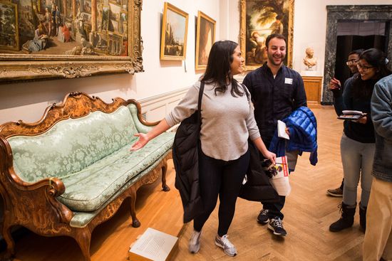 An antique sofa at the MFA reminded Katiary Munoz (Questrom'19) of her Latina heritage and how her parents prized such pieces, as she explains to Andrew Macey (Questrom19) and Anushka Sah (Questrom'19).