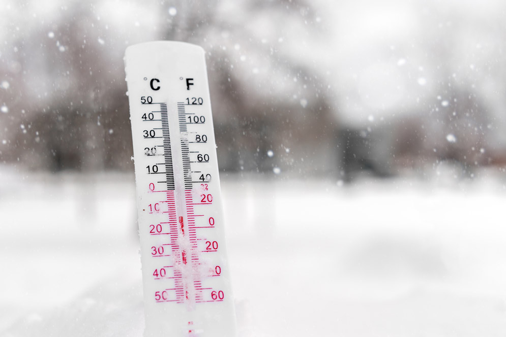 A thermometer displaying cold winter temperatures