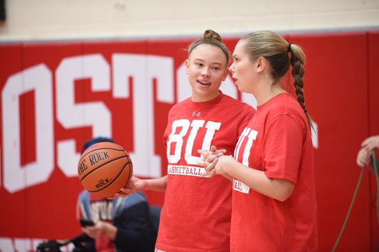 Captain Corinne Williams chats with a teammate