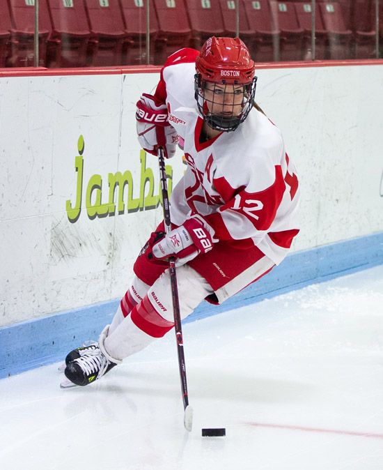 Victoria Bach skates down the ice with the puck 