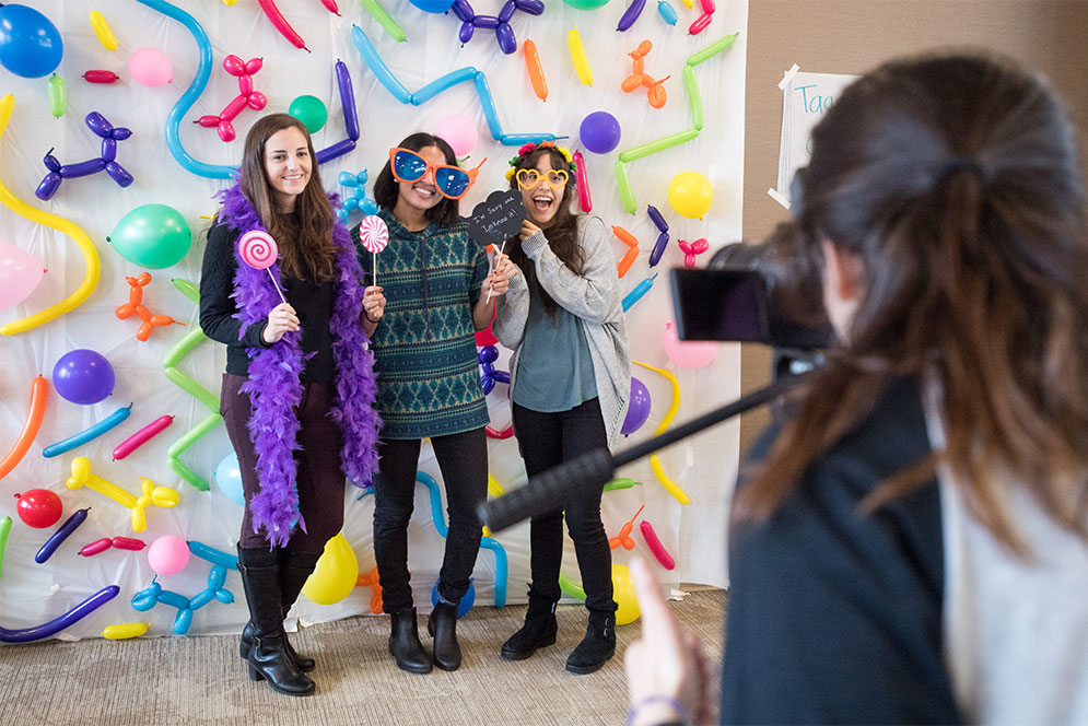 Students take a photo at the photo booth at the BU School of Medicine Wellness Initiative's second annual Wellness Fair