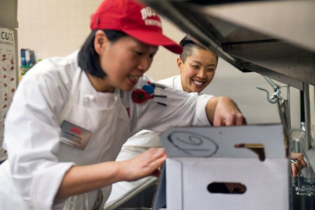 Chef Kristen Kish oversees a culinary student in the Metropolitan College’s Programs in Food and Wine