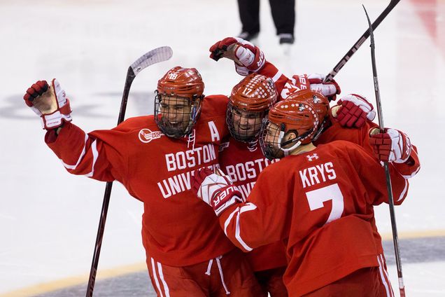 BU men’s ice hockey team cheers on the ice.