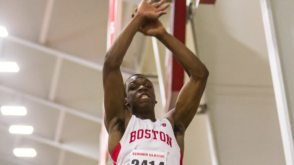 David Oluwadara during a triple jump for the BU indoor track team
