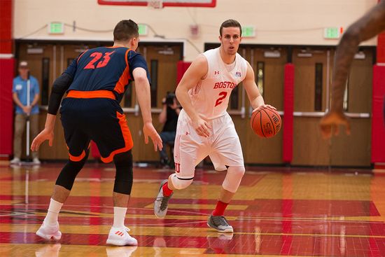 Boston University men's basketball player Tyler Scanlon dribbles the ball during a game against Bucknell University