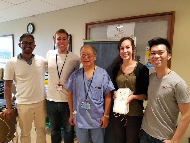 From left to right, Mohit Dangeti (BME ’17, ’19), Charles Scheftic (BME ’18), Director of the Neonatal Intensive Care Unit at Boston Medical Center (BMC) Dr. Alan Fujii, Elizabeth Sridhar (BME ’18), Nicholas Leung (BME ’17) gather at BMC to show off the neonatal vitals monitoring pad prototype.