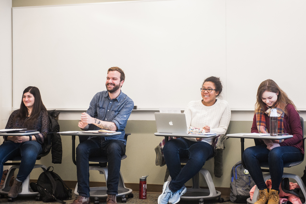 Instructor Ethan King (center) reacts to a performance of a “Lost Hamilton Track” with students (from left) Allison Burton (SHA’20), Jericha Tavares (CAS’20), and Chloe Lankford (CAS’21)