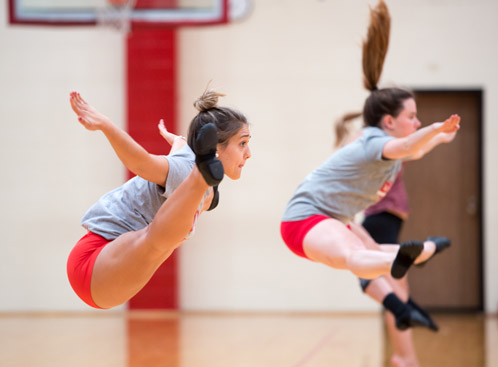 Romano performs a straddle jump Romano performs a straddle jump